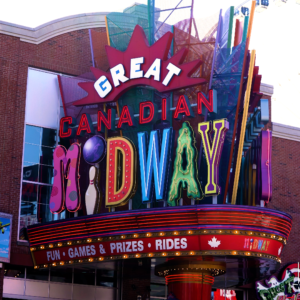 A large sign displaying the text "Great Canadian Midway" in bold letters against a colorful background.